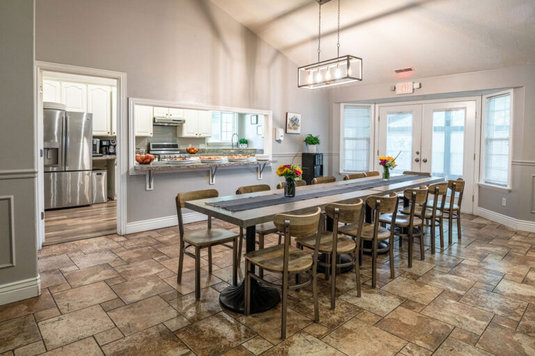 Dining area with long table at Ascend Recovery