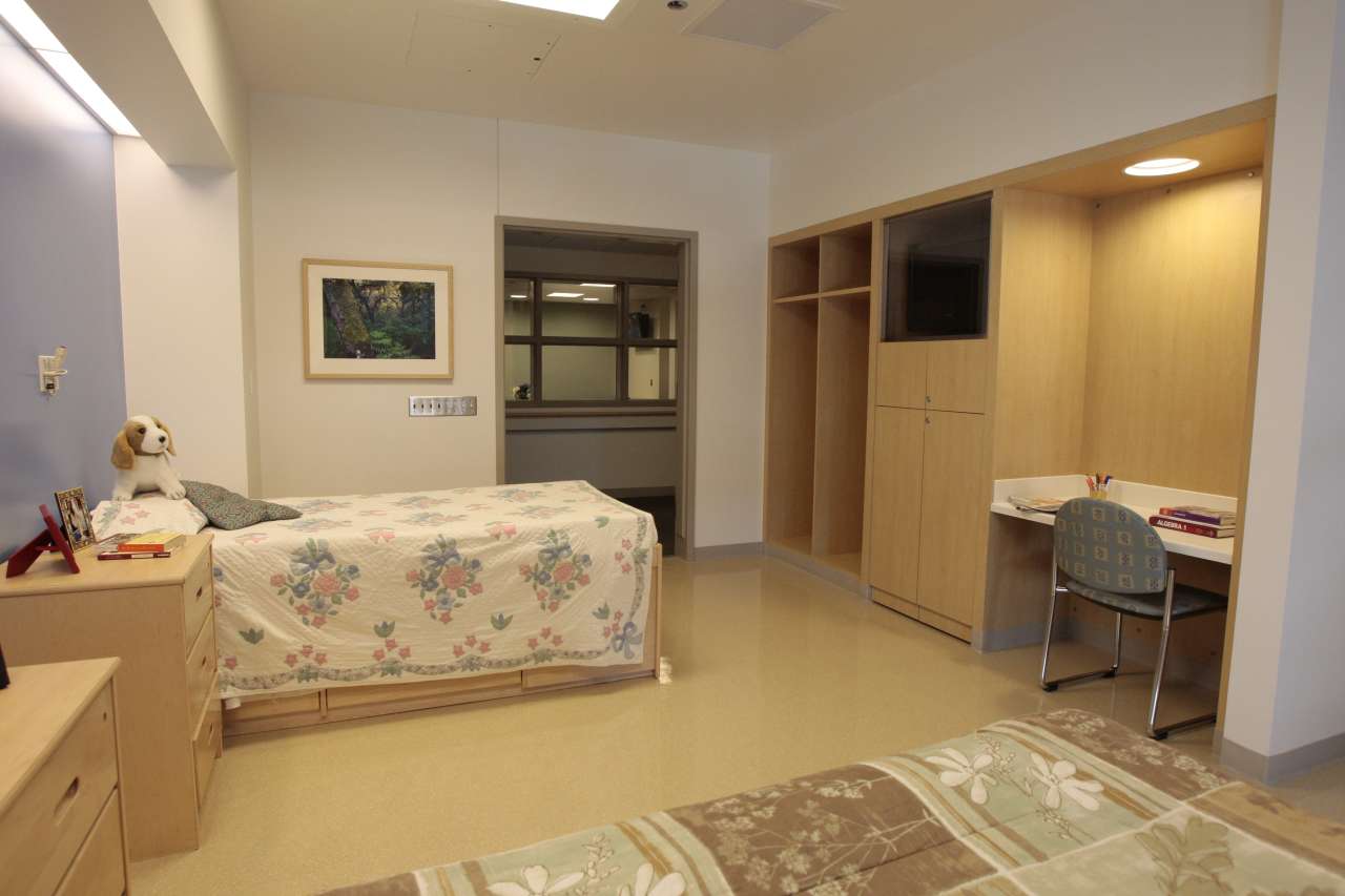 Shared patient room with beds and study area