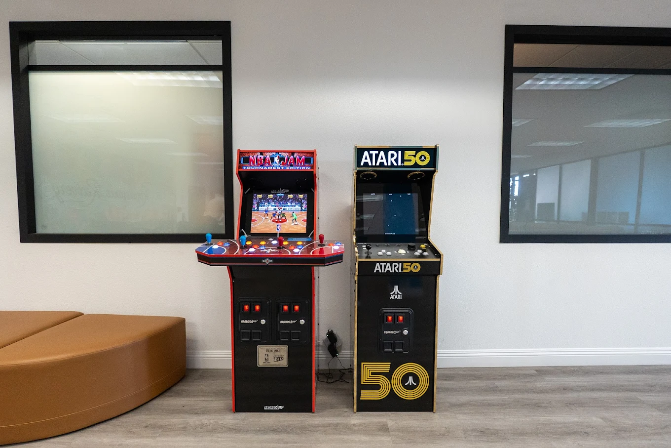 Arcade machines with NBA Jam and Atari 50 in lounge