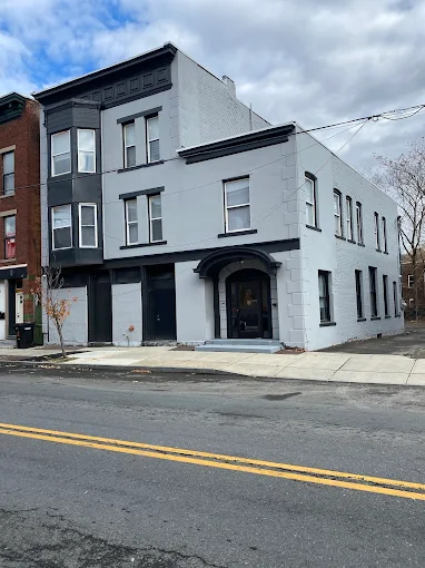 Outpatient clinic exterior with gray facade and street view