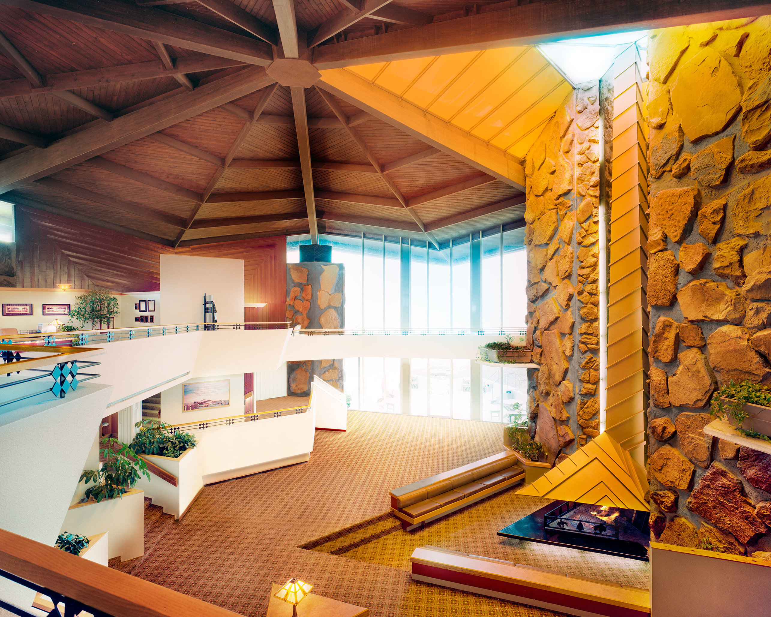 Large lobby with stone walls and open seating areas