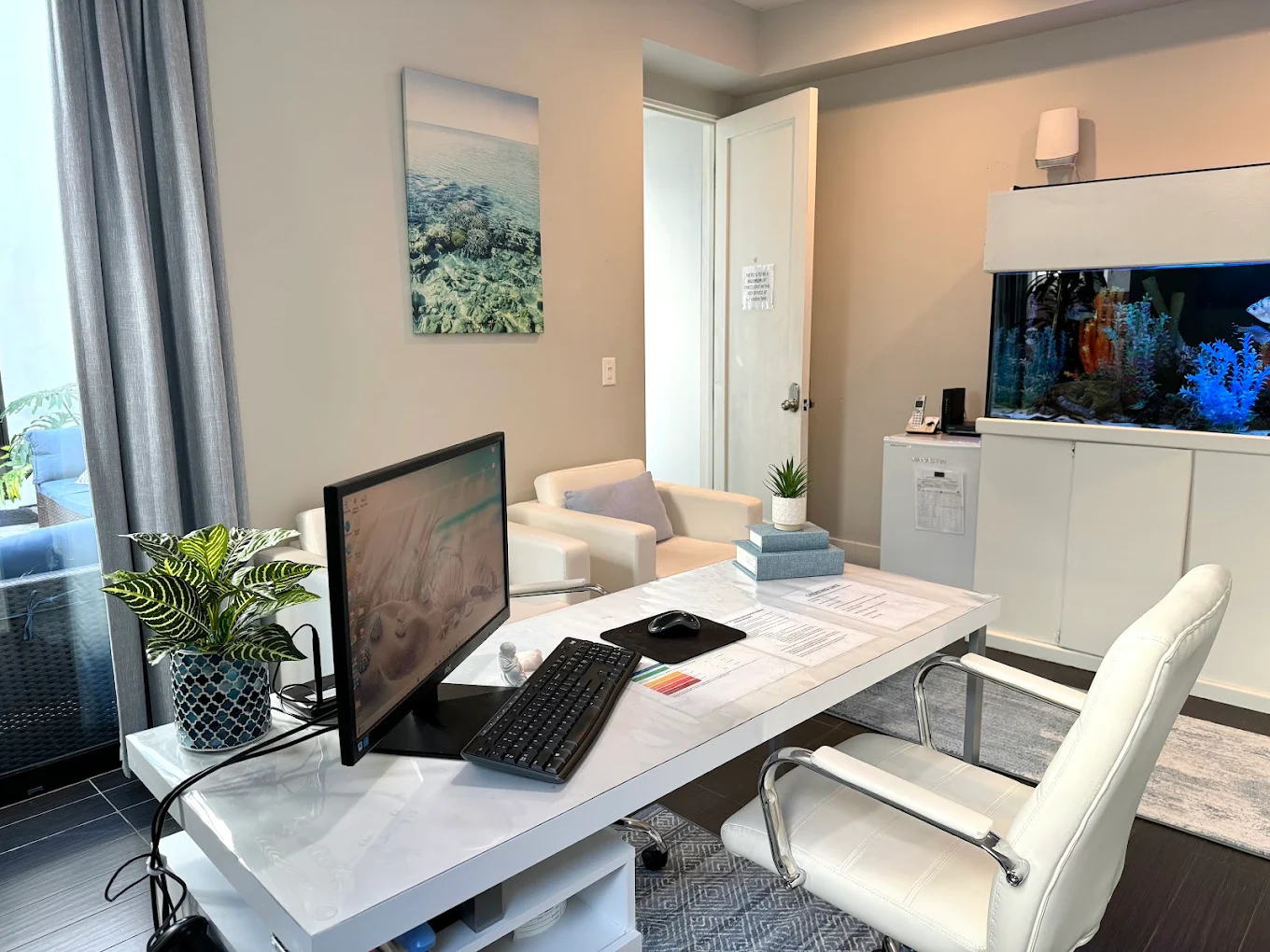Bright office with desk, chairs, and wall art