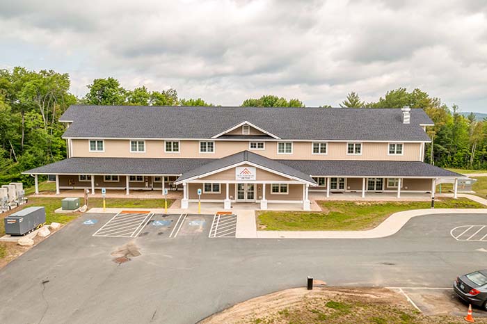 Front of building with parking area