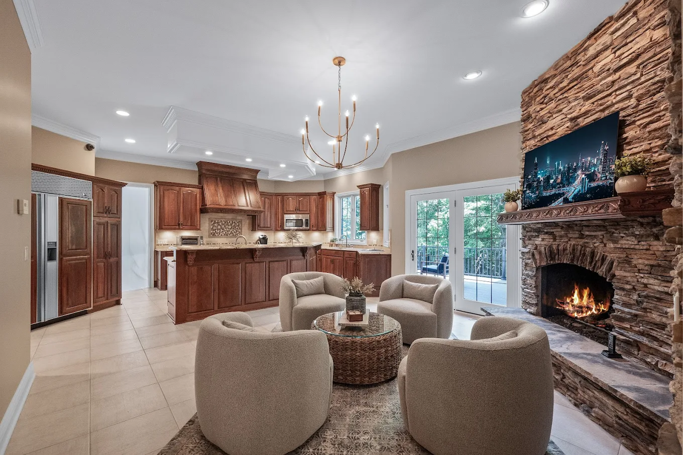 Open kitchen with island and sitting area by fireplace