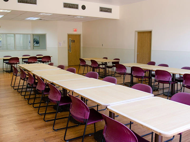 Patient dining room with tables and chairs for meals
