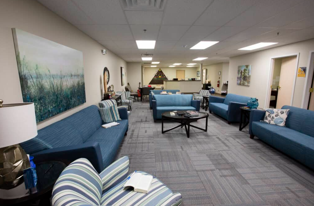 Common lounge with couches and tables for patients