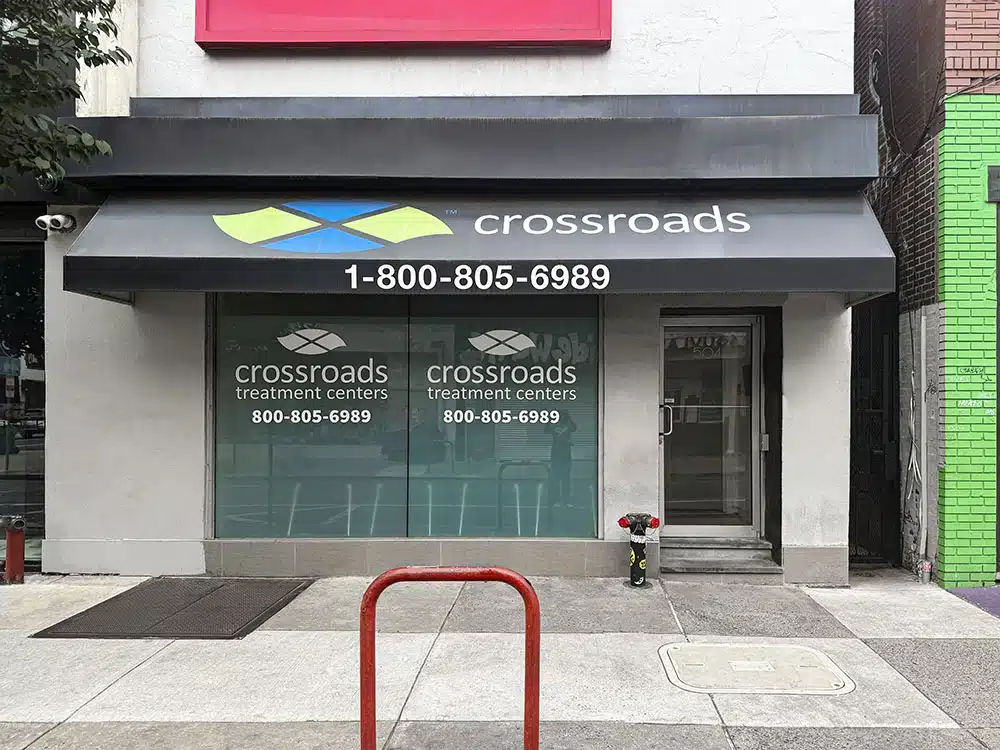 Storefront clinic entrance with Crossroads sign