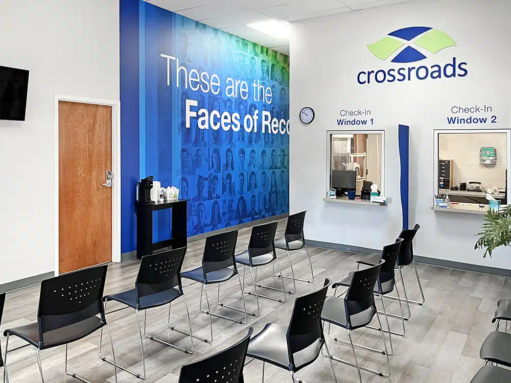Waiting room with chairs and check-in windows