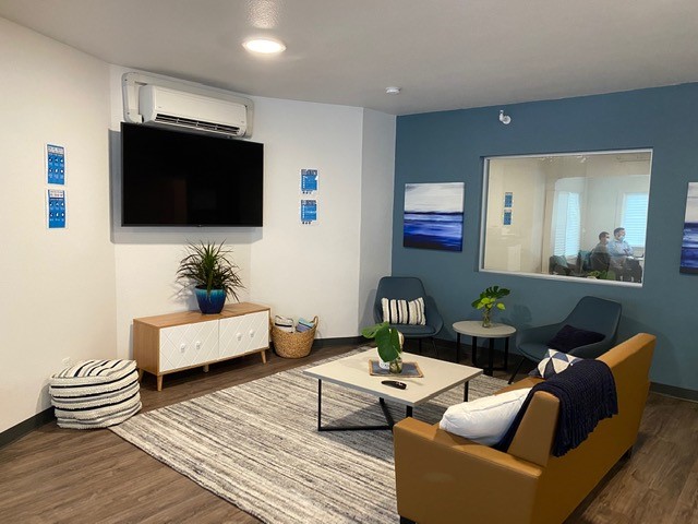Modern lounge with television and comfortable seating