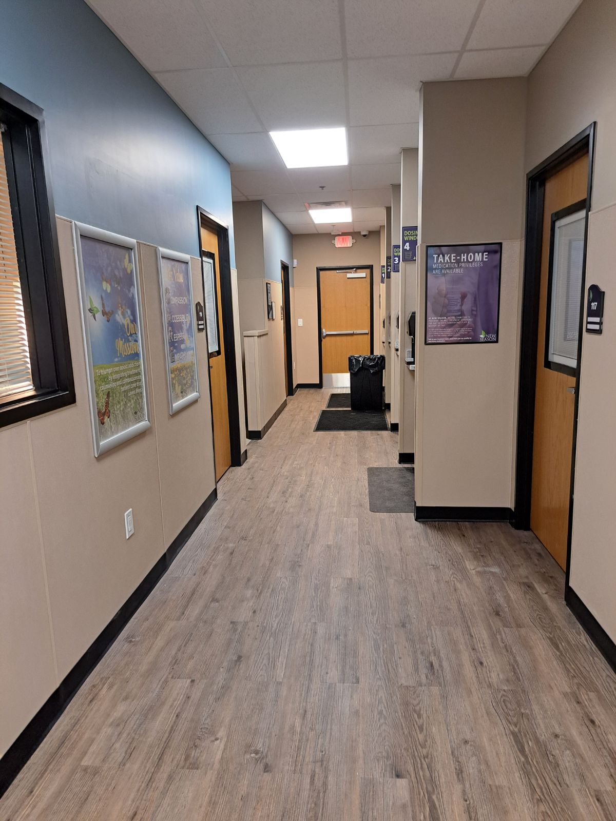 Clinic hallway with take-home medication signage.