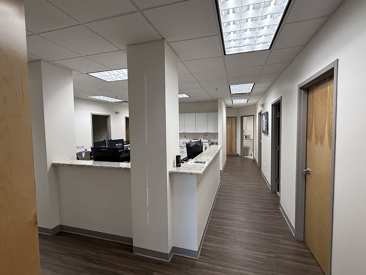 Hallway with reception desk and office doors