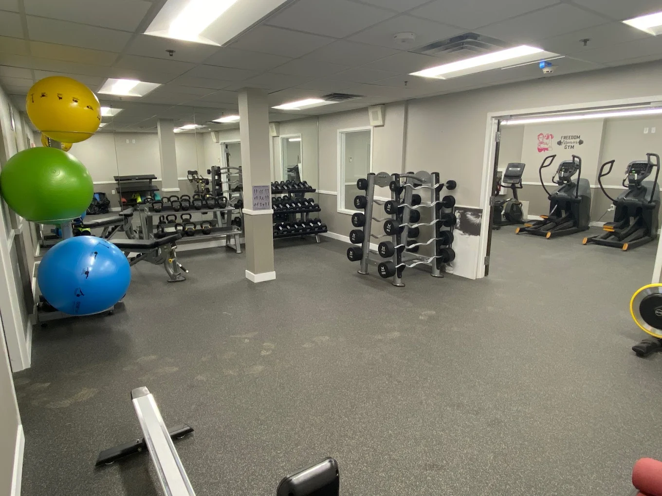 Fitness center with cardio machines and free weights