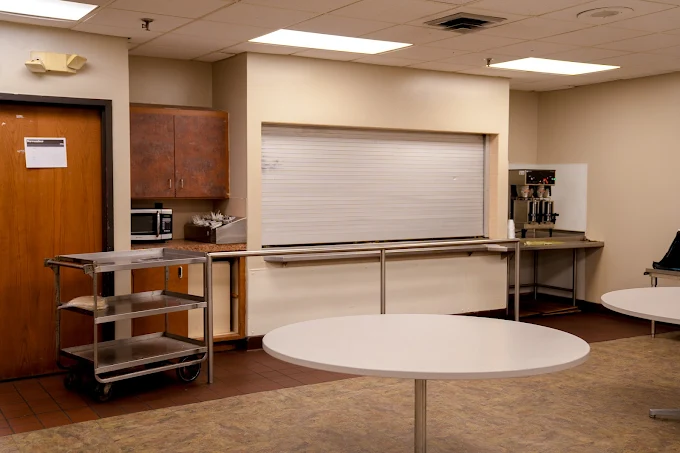 Dining space with round tables and service counter