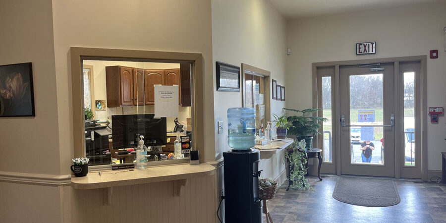 Check-in window and water cooler near entrance