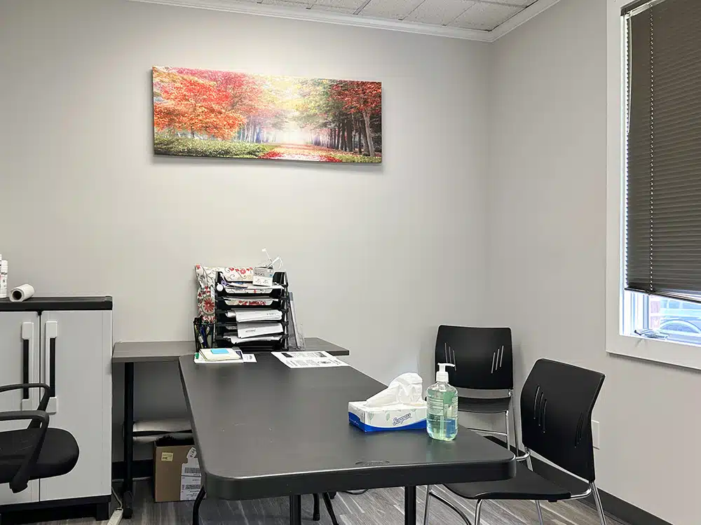 Private office with desk, chair, and wall art