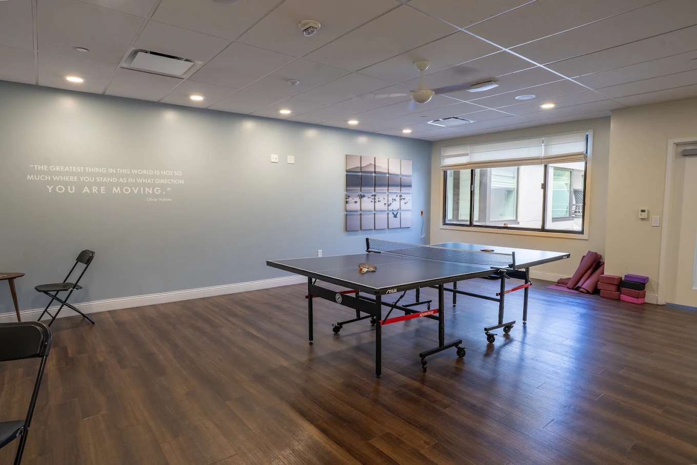 Recreation room with ping pong table and exercise mats