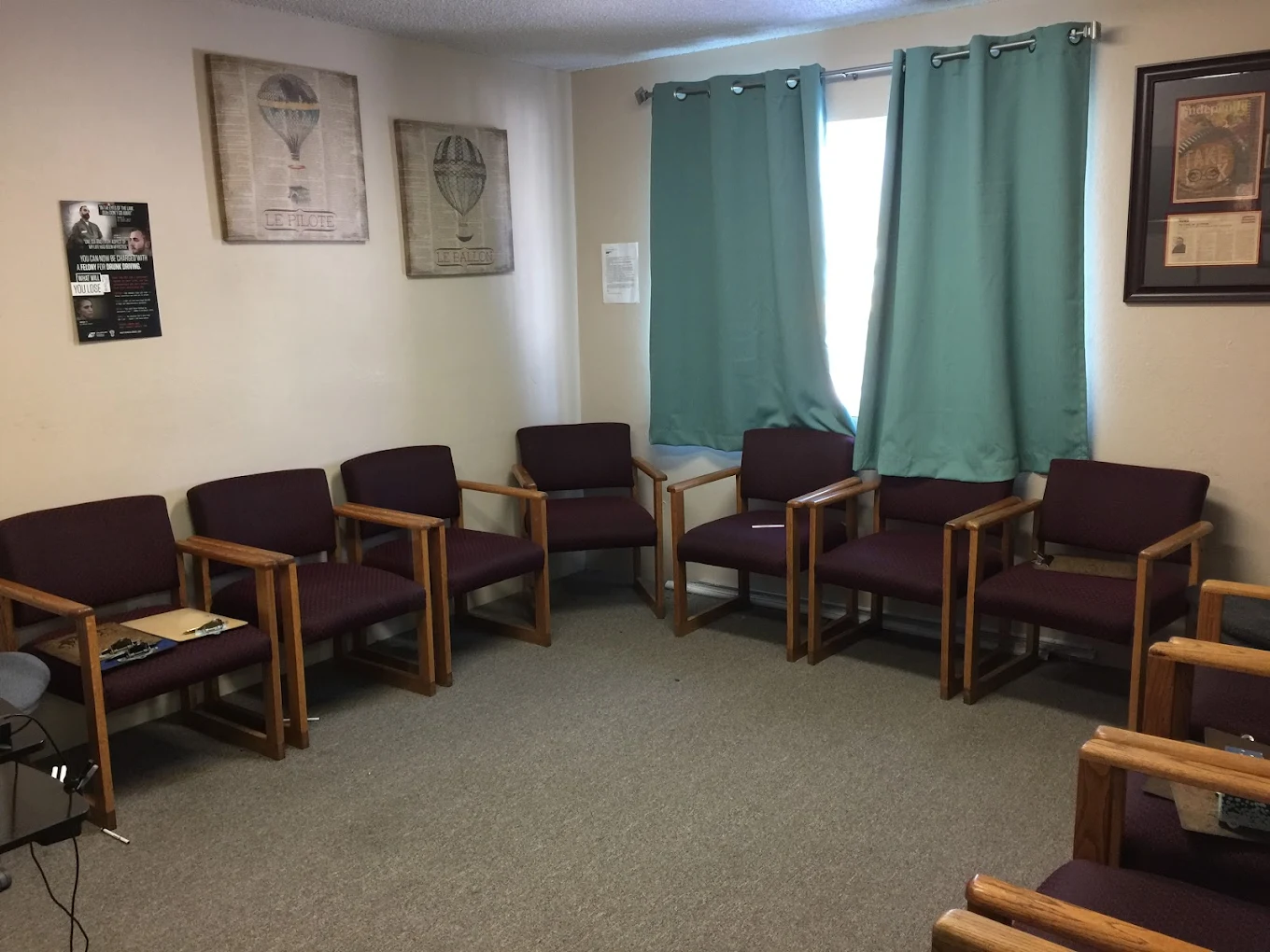 Group therapy room with purple cushioned chairs