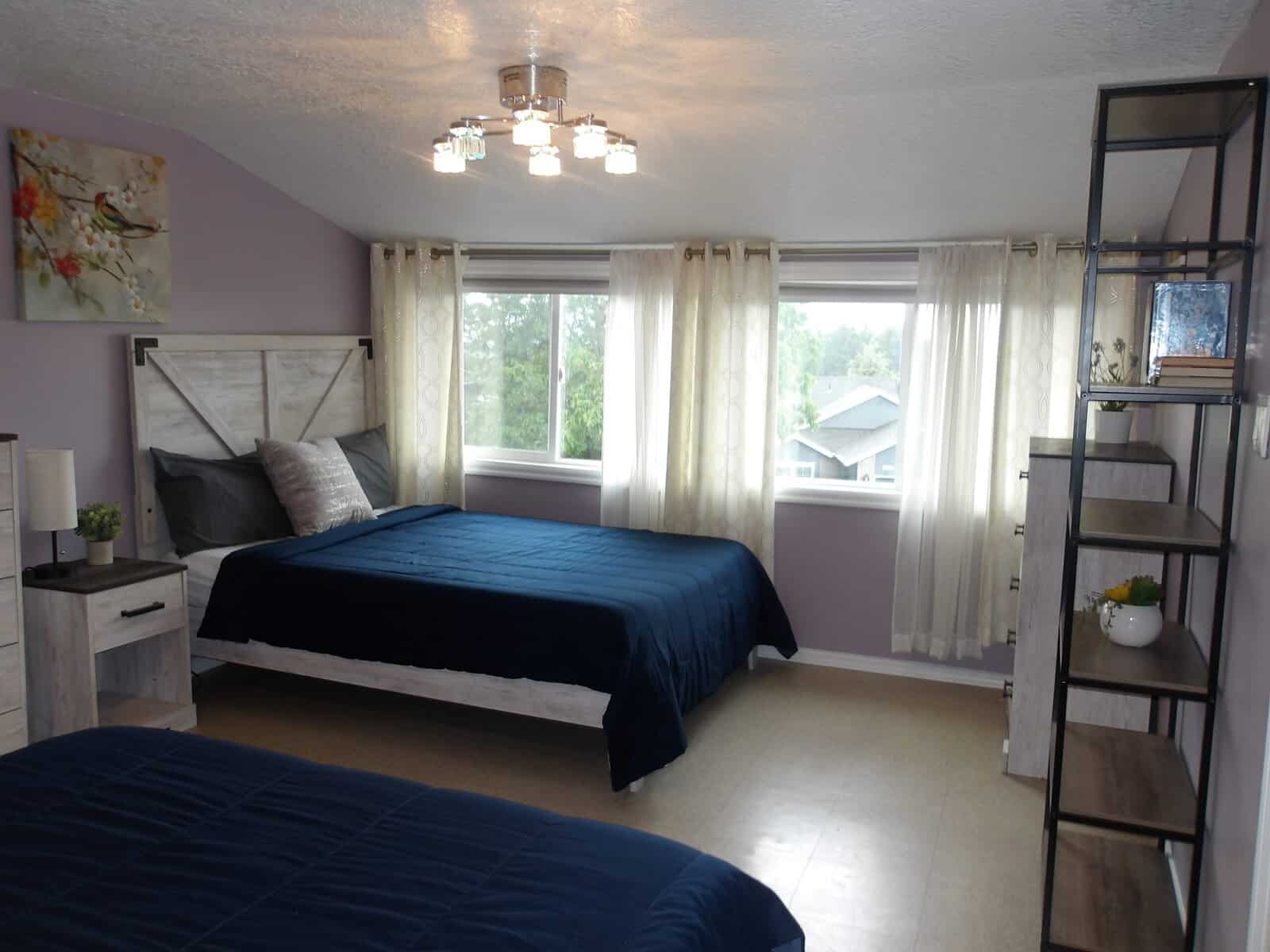 Shared bedroom with two beds and natural light