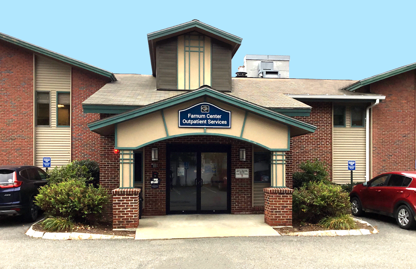 Main entrance with sign reading Farnum Center Outpatient Services