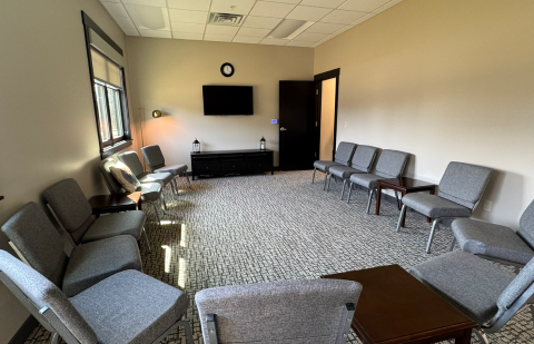 Group therapy room with chairs arranged for discussion