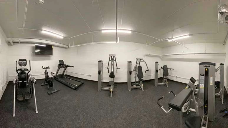Gym with treadmills, bikes, and weight machines