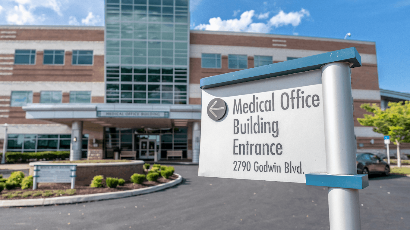 Medical office building entrance sign outside facility