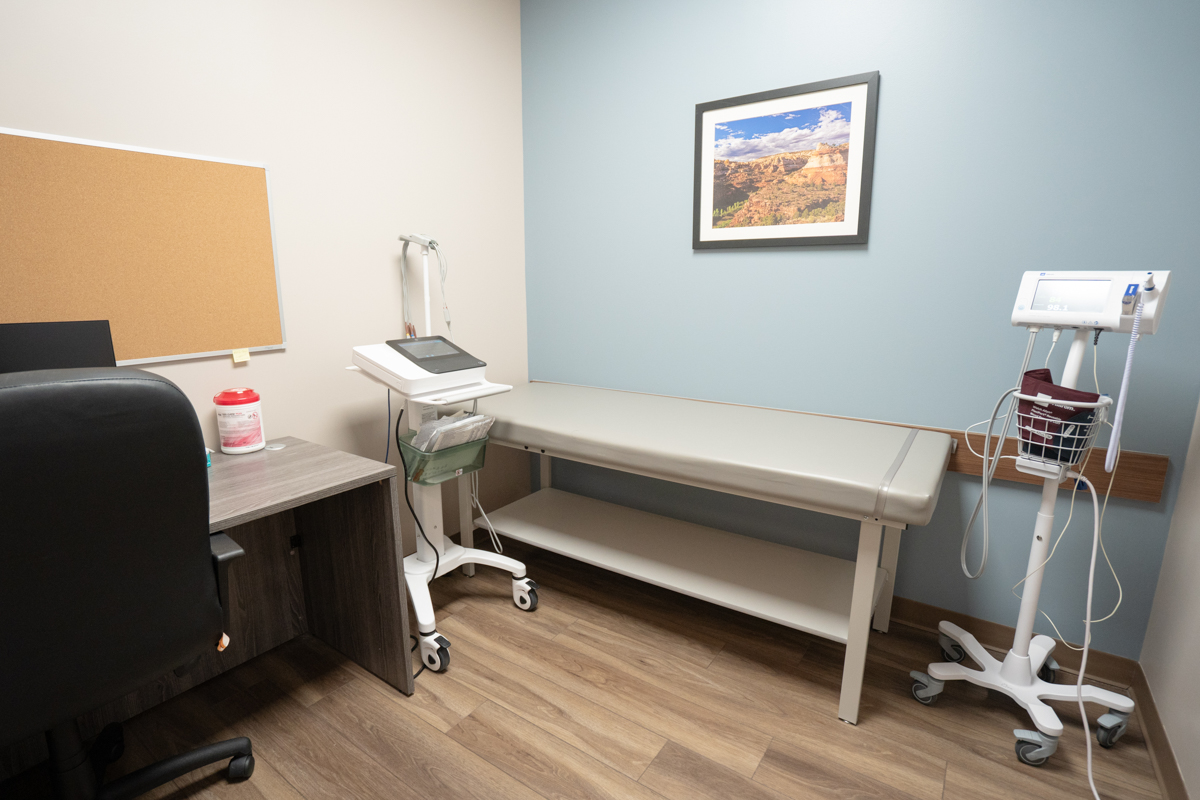 Exam room with treatment table and medical equipment