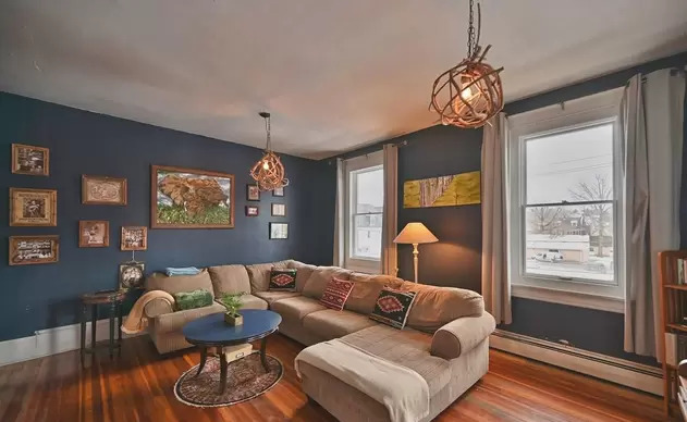 Cozy living room with sectional and artwork