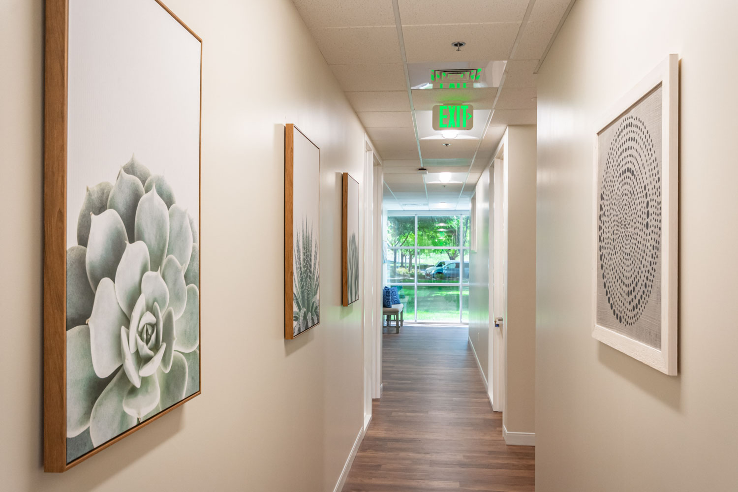 Bright hallway with framed artwork and natural light