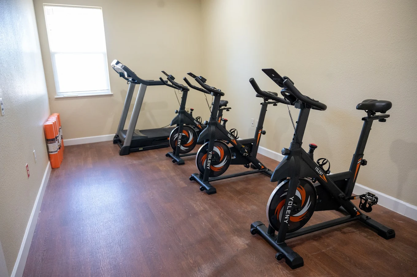 Fitness room with stationary bikes and treadmill