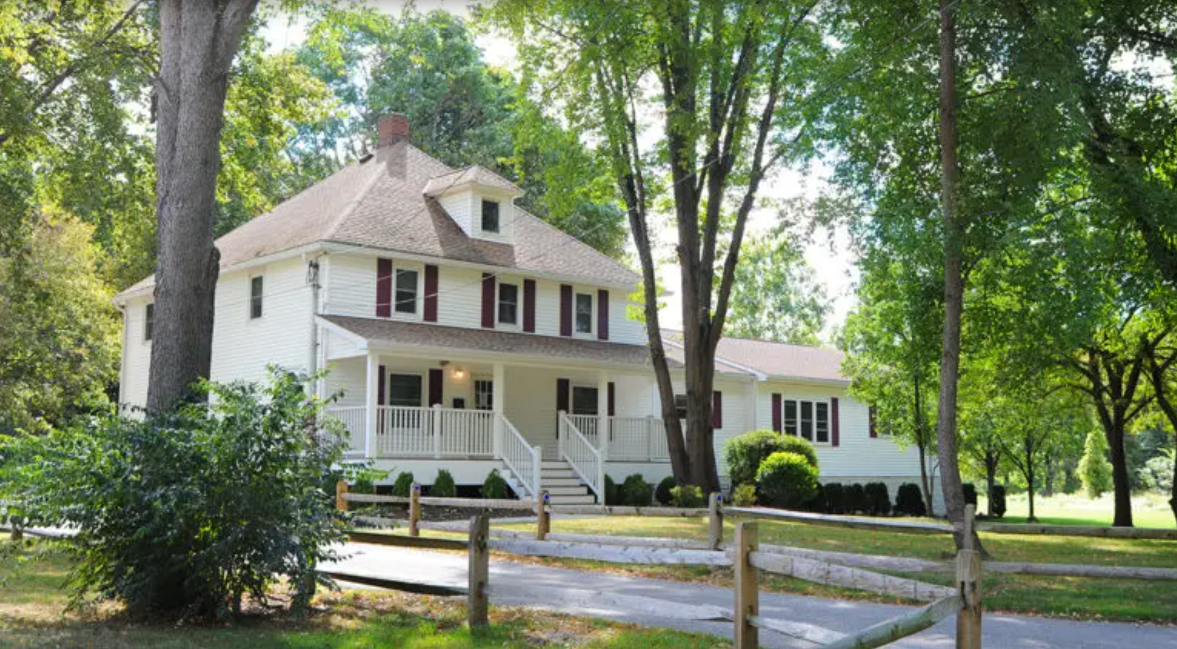 Exterior view of recovery center surrounded by trees.