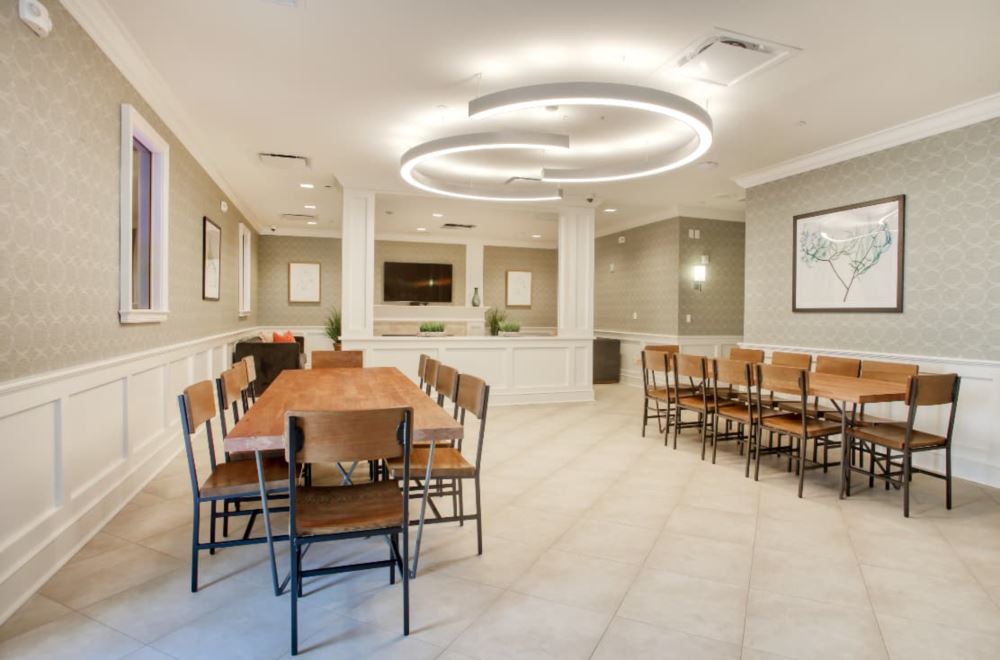 Spacious dining room with wood tables and modern lighting