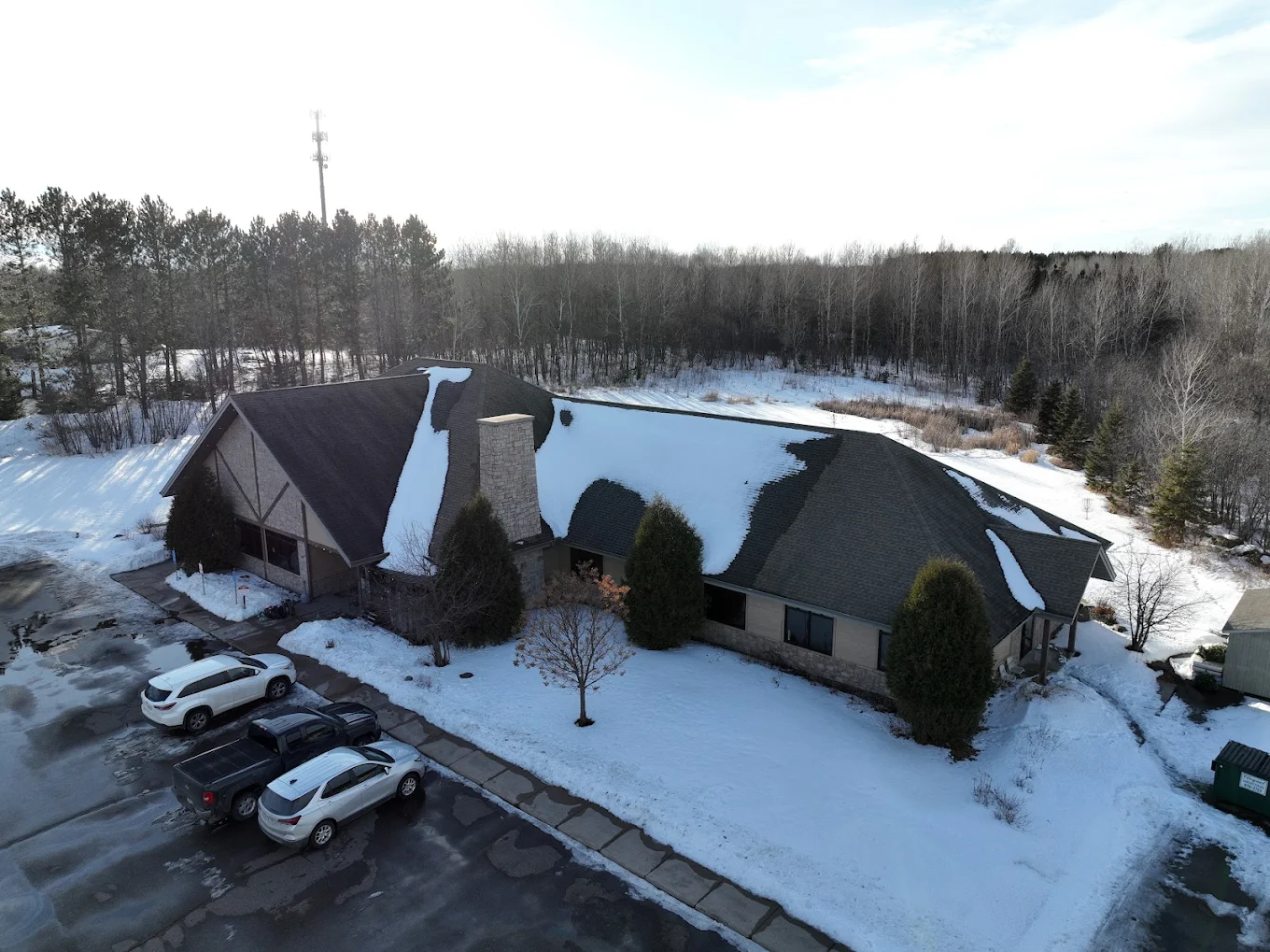 Snow-covered aerial view of Pioneer Recovery Center and surrounding forest in Cloquet