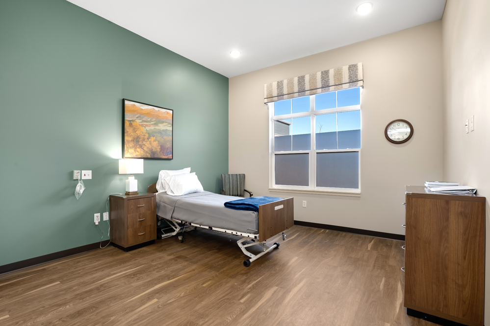Private medical recovery bedroom with adjustable bed