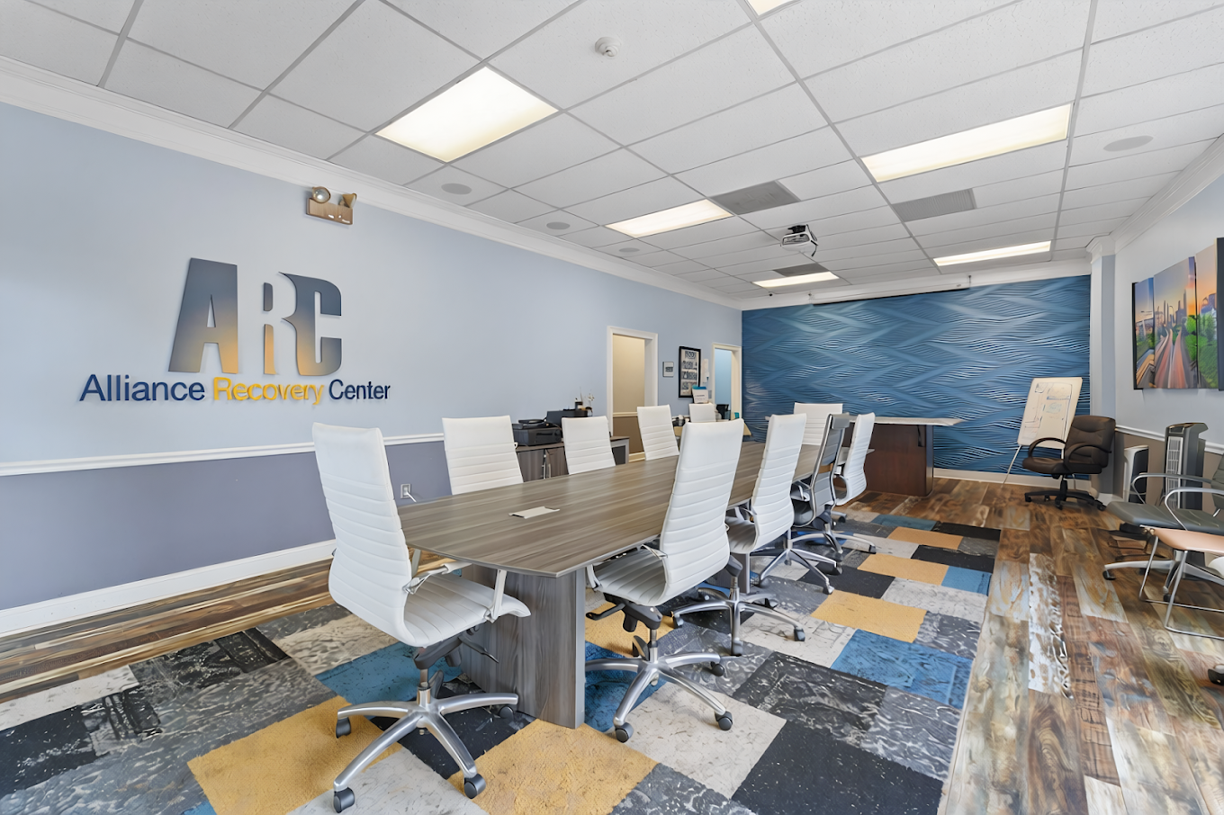 Meeting room with conference table and seating for groups