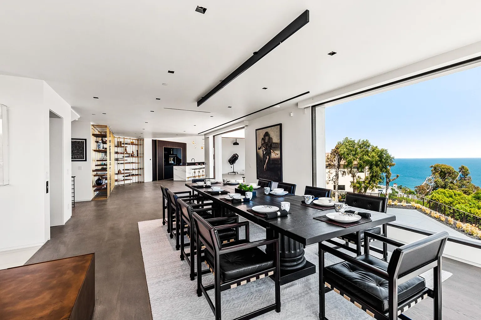 Communal dining room with ocean views and seating