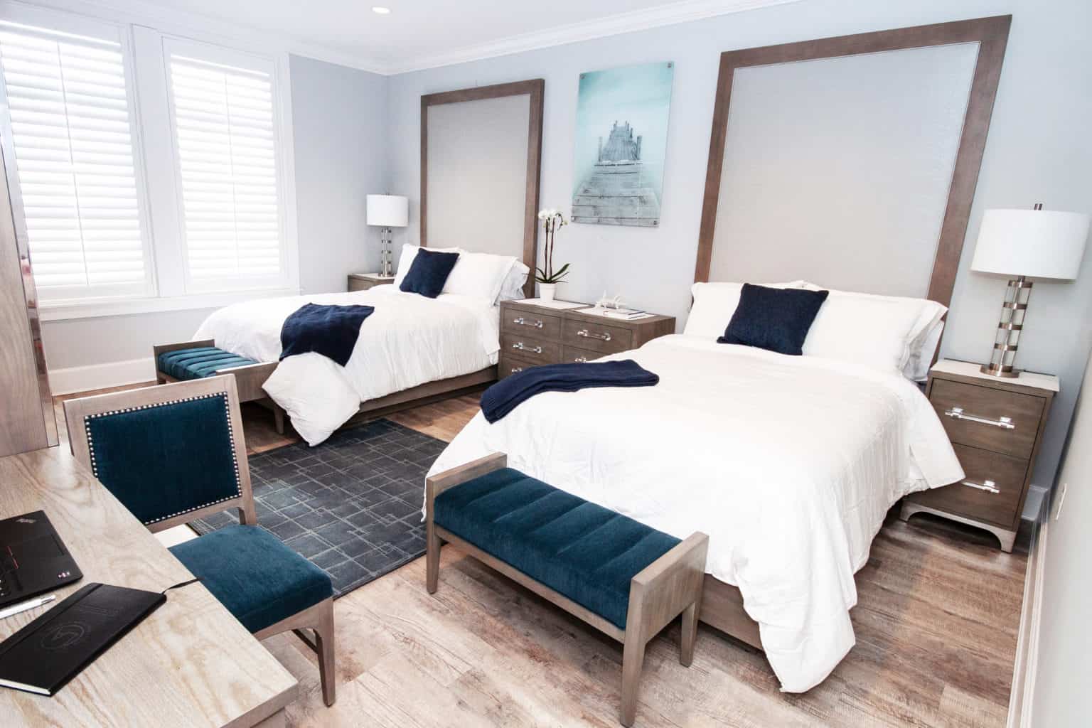 Two-bed suite with wood accents and navy decor