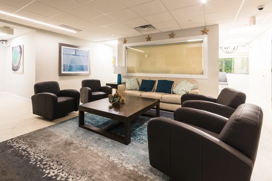 Cozy lounge with cushioned seating and large coffee table