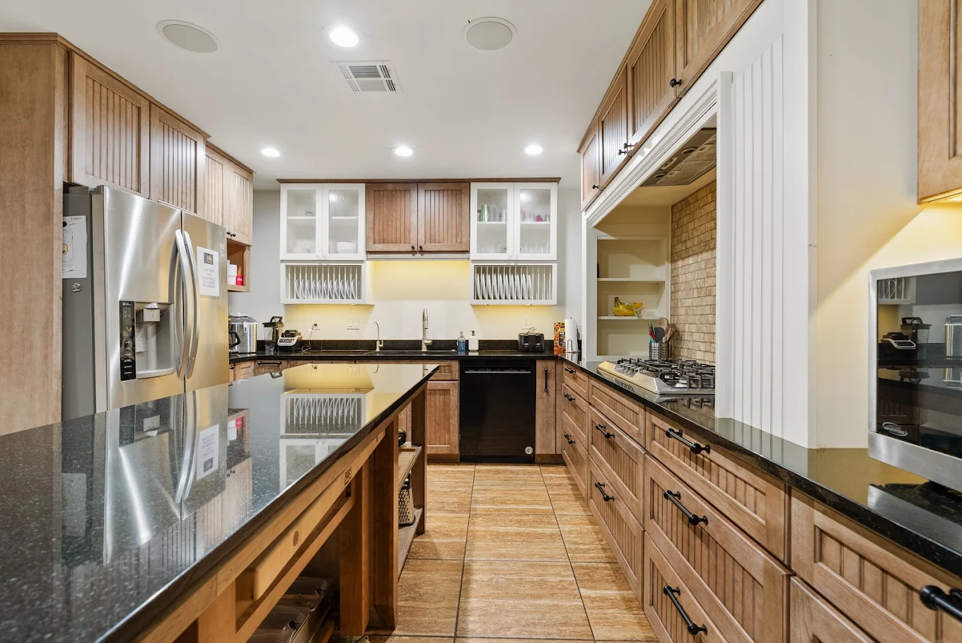Full kitchen with wood cabinets and stainless steel appliances