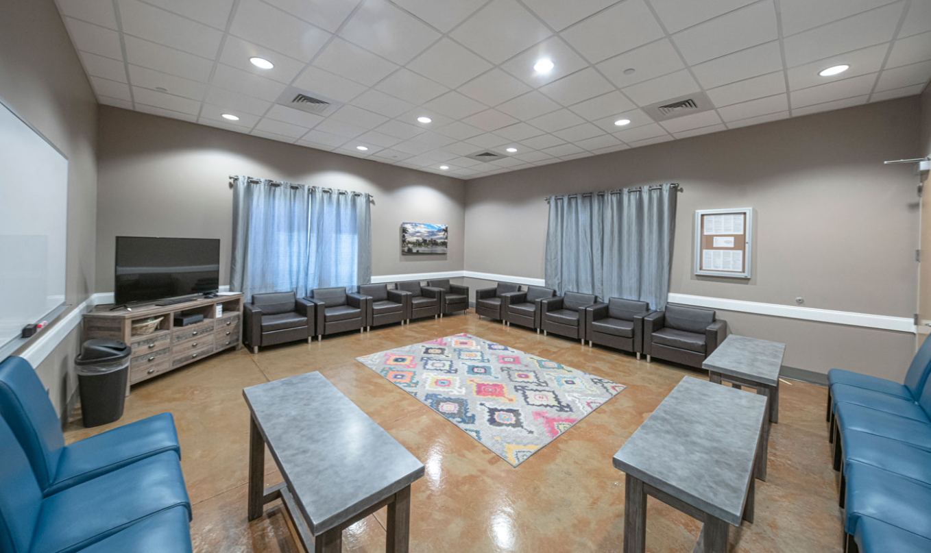 Group therapy room with seating arranged for sessions
