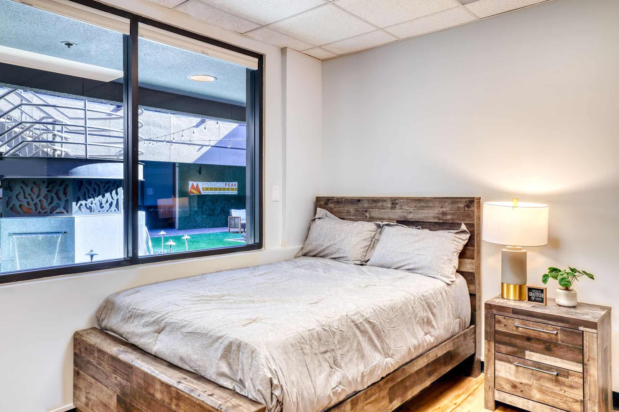 Private bedroom with queen bed and bedside table