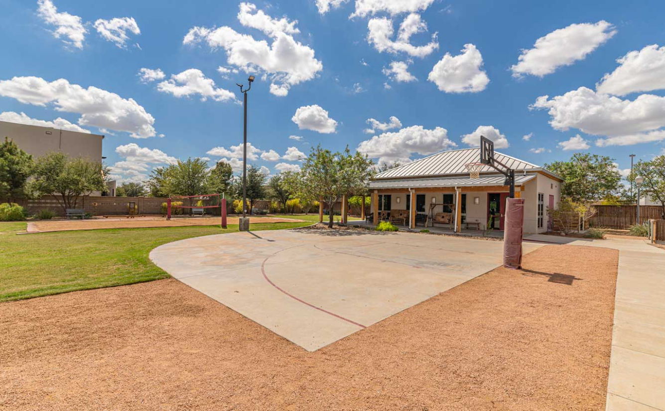 Outdoor basketball and volleyball courts on campus