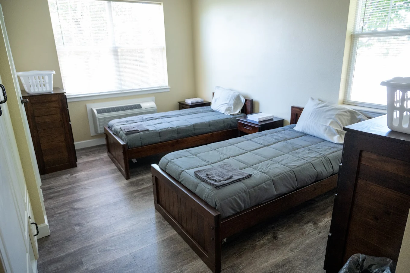 Double bedroom with two twin beds and large windows