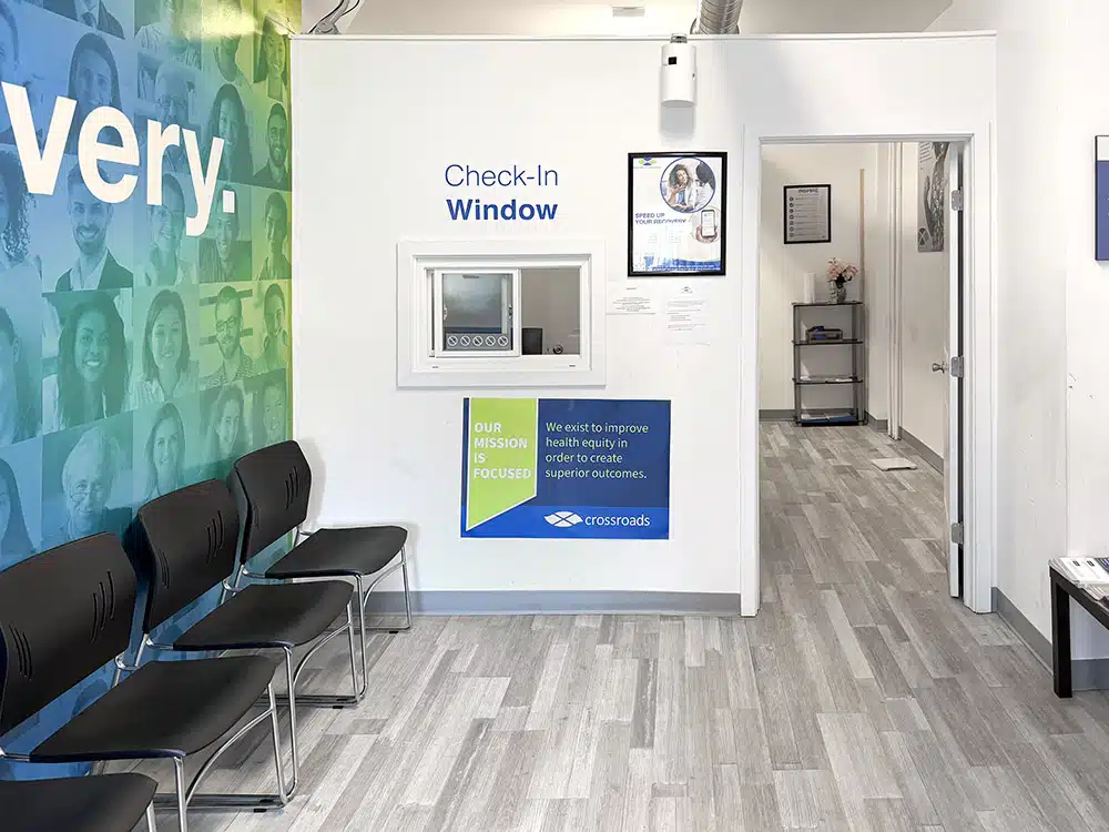 Waiting room seating near check-in and hallway