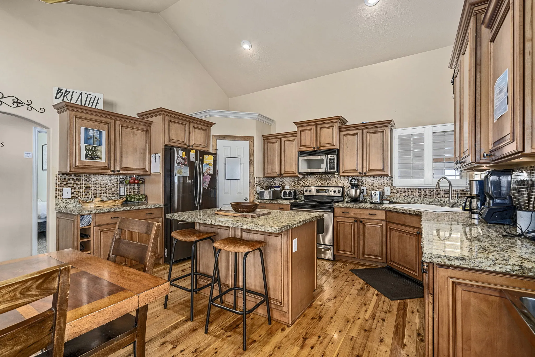 Full kitchen with granite counters and center island
