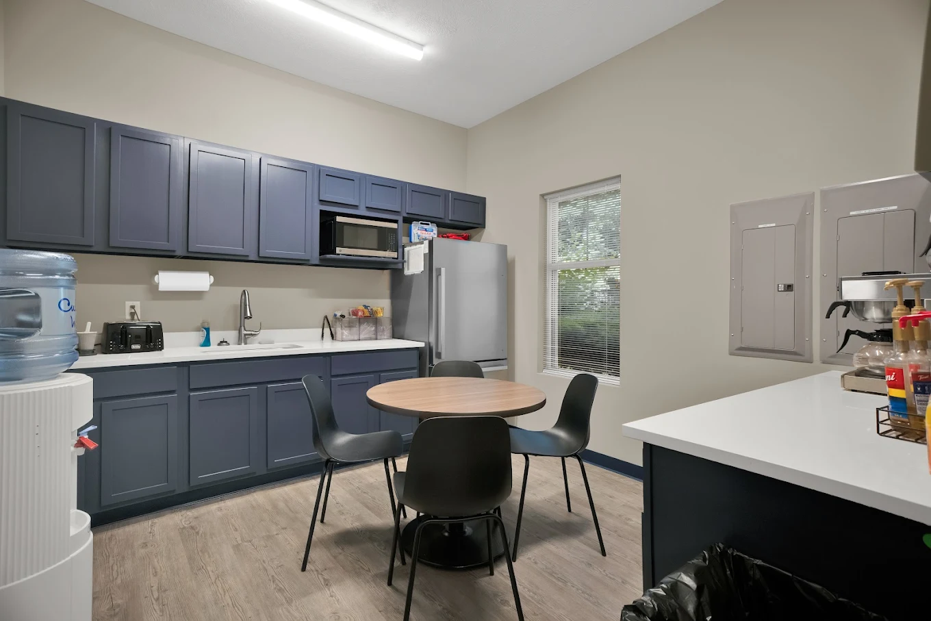 Kitchen with dining table and appliances