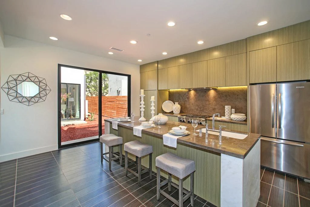 Spacious kitchen with island seating and wood cabinets