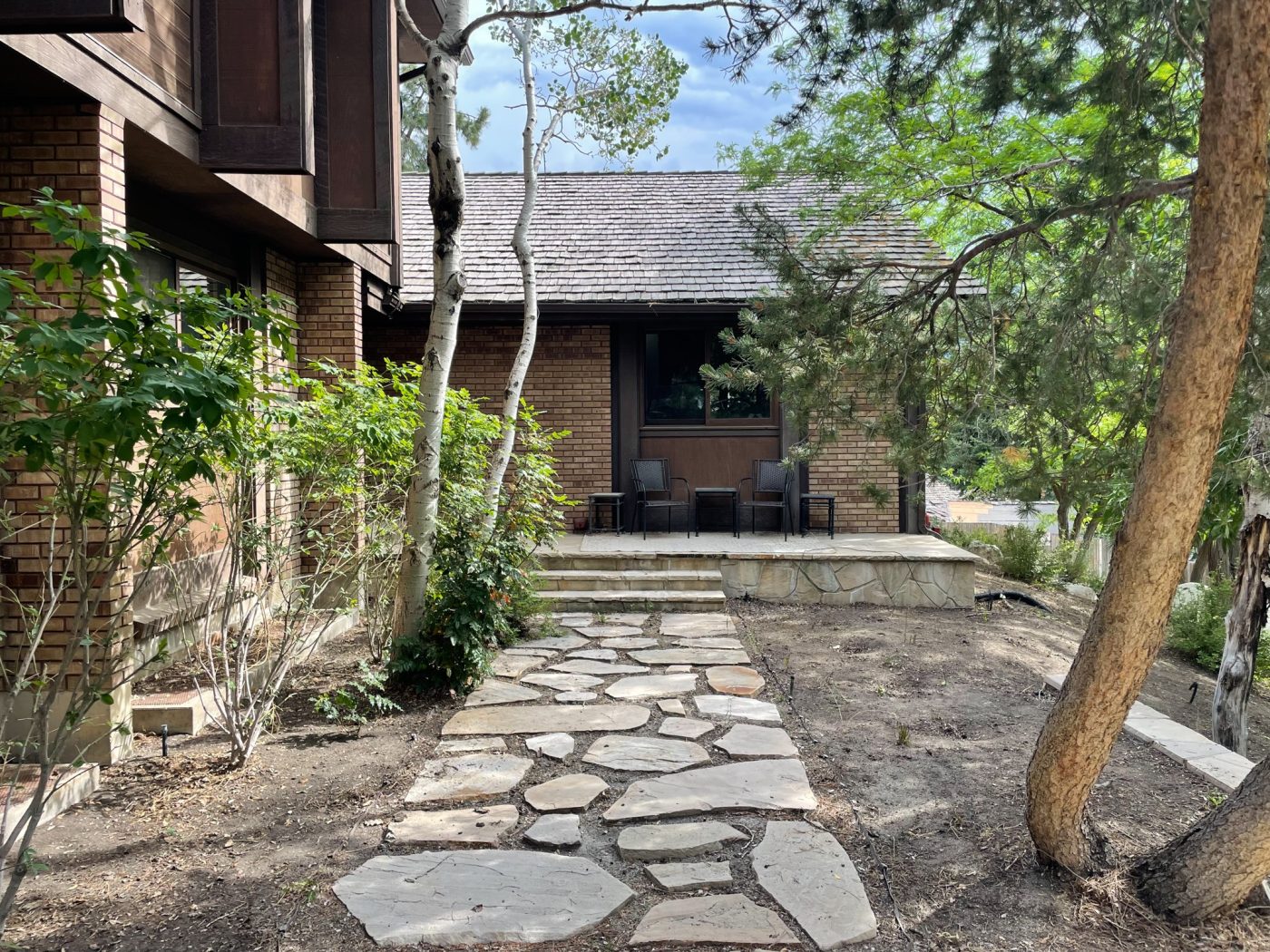 Stone walkway leading to outdoor seating area