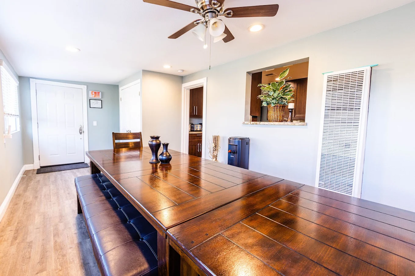 Large wooden dining table with bench and chairs