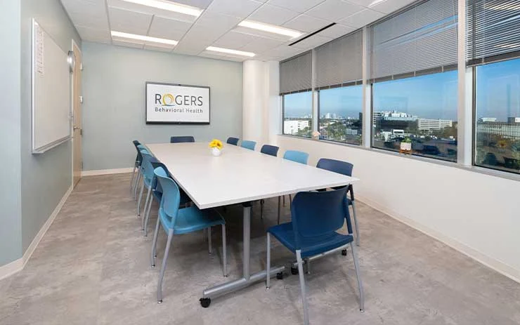 Conference room with table and chairs at Tampa clinic
